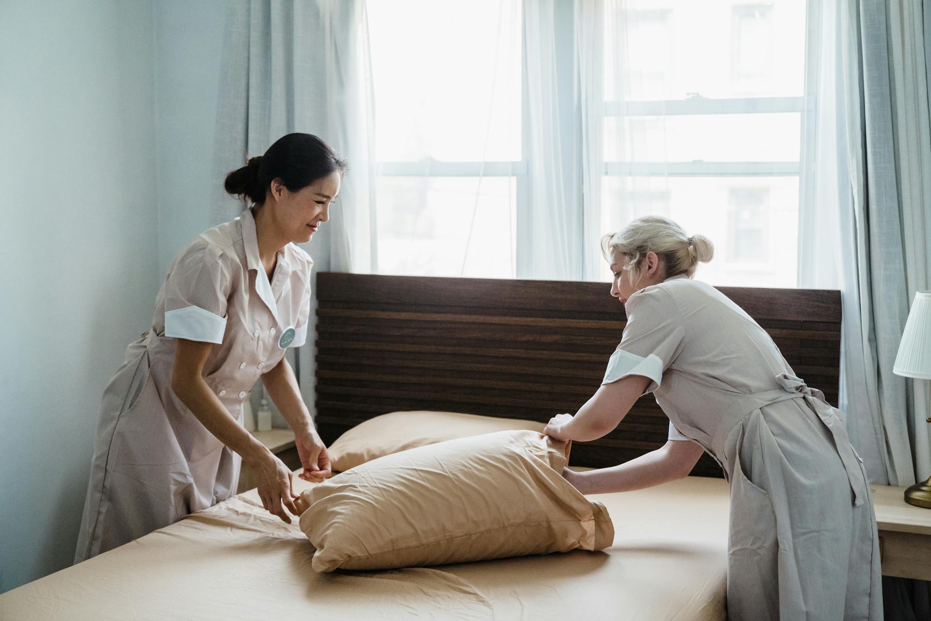two women cleaning the Bedroom