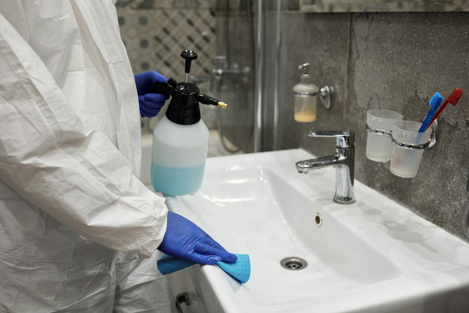 a woman cleaning the bathroom