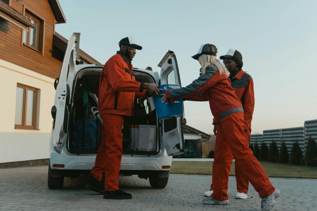 group of friends with cleaning materials